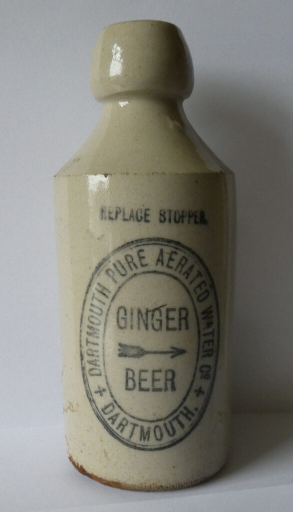 Dartmouth Pure Aerated Water Company stoneware bottle, ginger beer, transfer printed. About 1900.